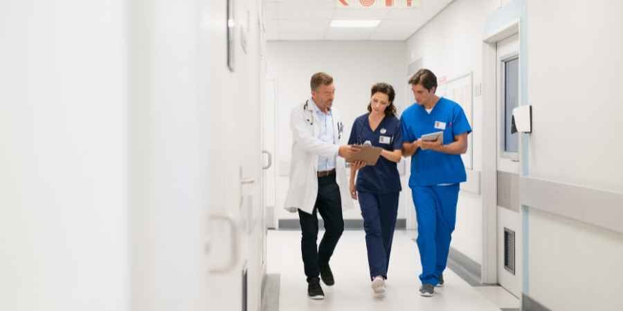 Doctors walking down a hospital hallway