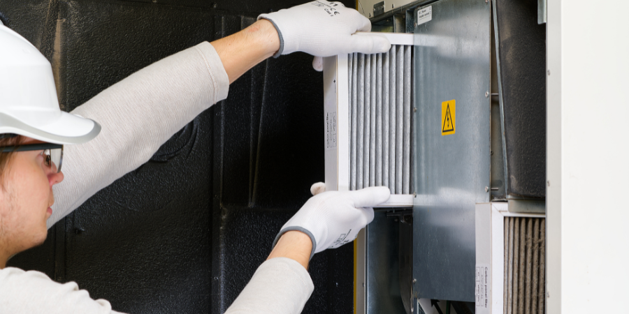 Blog_Man Changing HEPA Filter_900x450