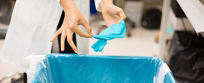 A doctor removing a disposable glove, illustrating a section titled, "What is Infection Control?"
