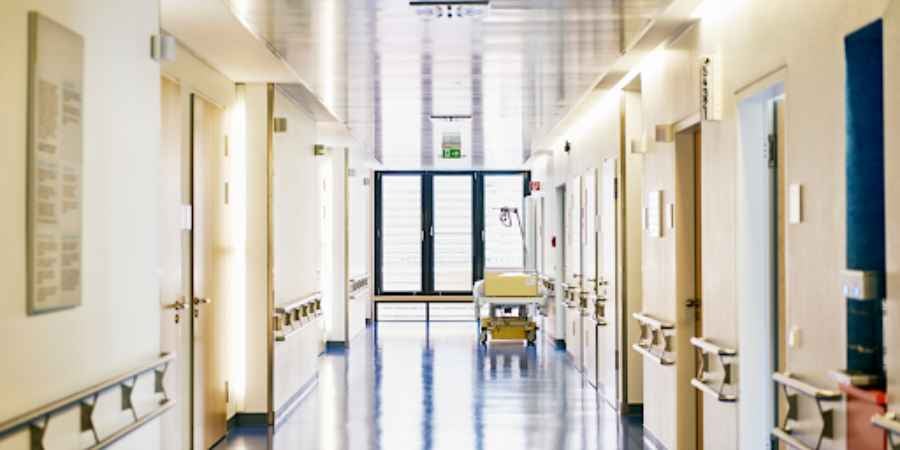 Hospital hallway with doors at the end