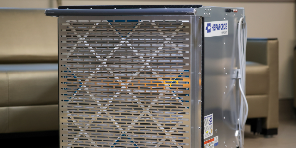 HEPAFORCE® portable HEPA air scrubber deployed in a healthcare facility hallway during a construction project
