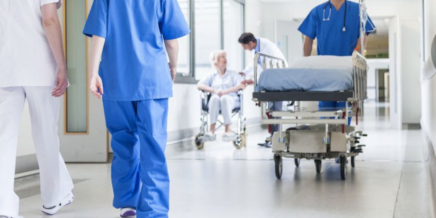 Hospital nurse with patient