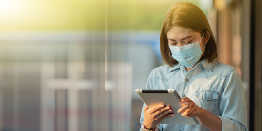 Woman in hospital working on tablet