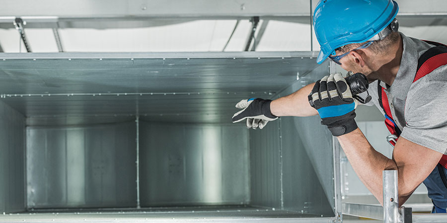 Man looking through air vent